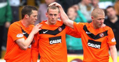 Robertson (c): Celebrates his headed winner